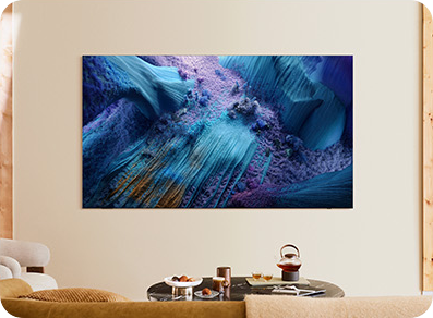 TV displaying blue abstract art on wall